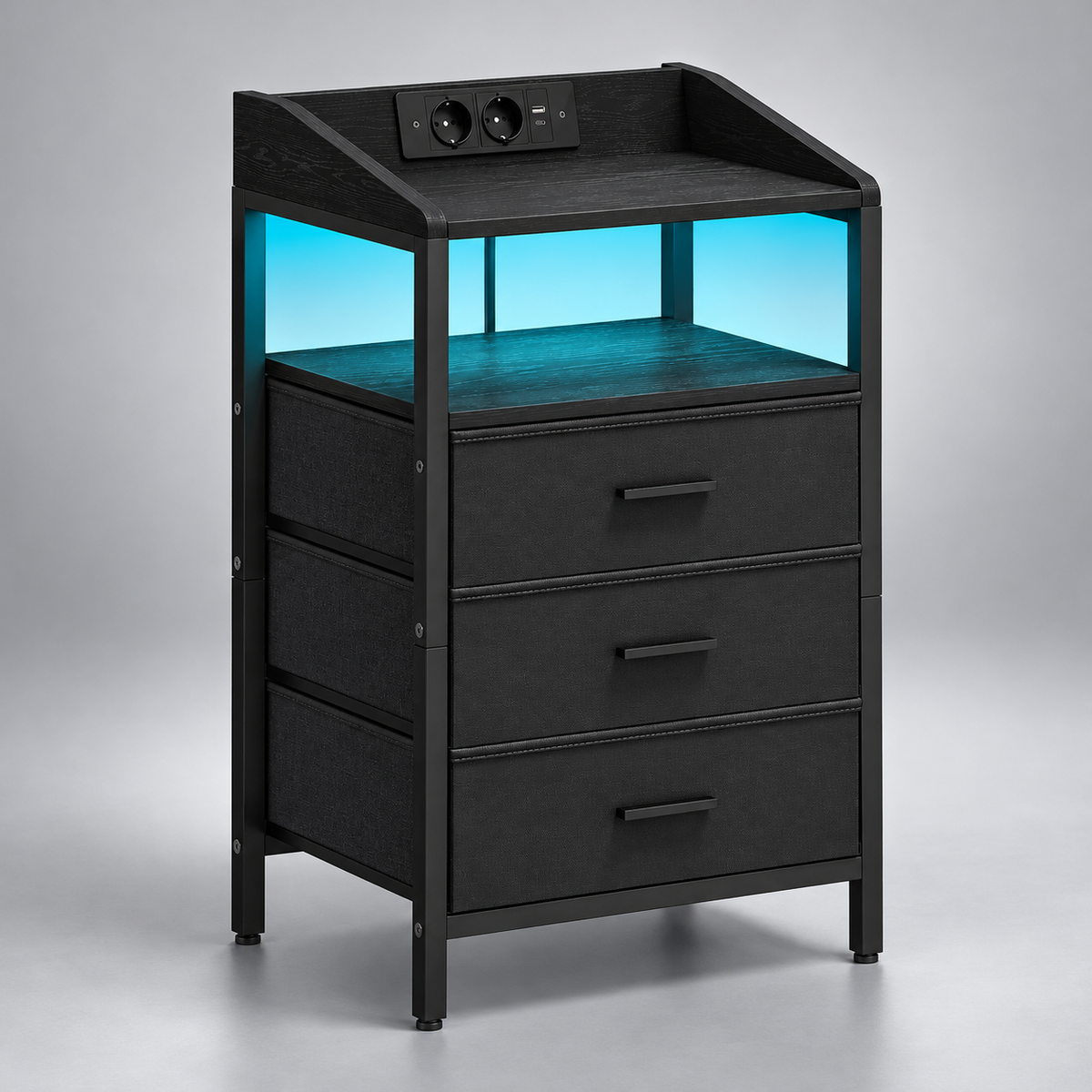 Chevet LED noir à trois tiroirs souples sur fond argenté.