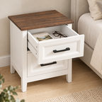 Table de chevet blanche avec tiroir supérieur ouvert et livre rangé
