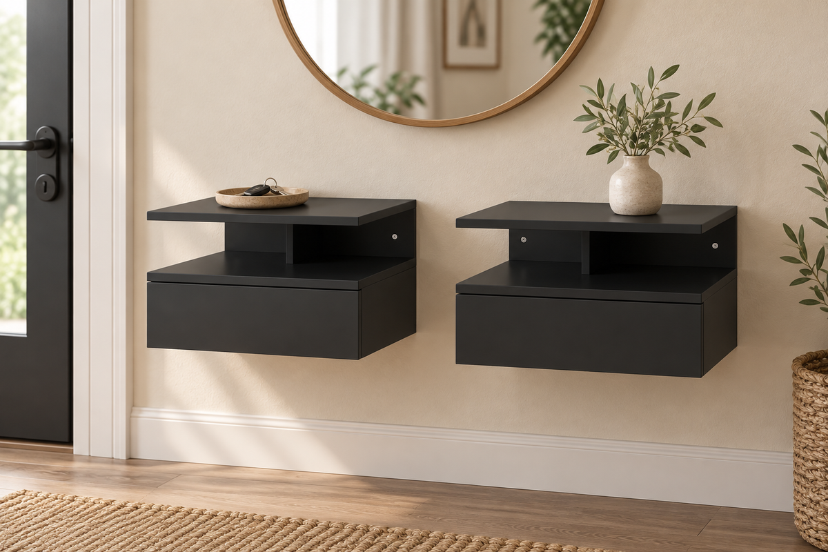 Deux rangements muraux noirs avec tiroir sous un miroir d’entrée.